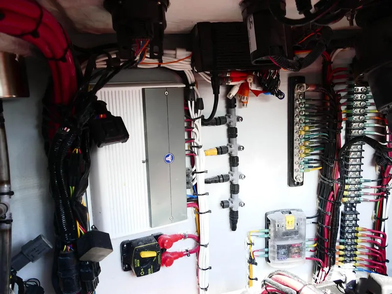 Slide: The Image of Electrical wiring and components inside a 2022 Contender 25 Bay boat. - 33