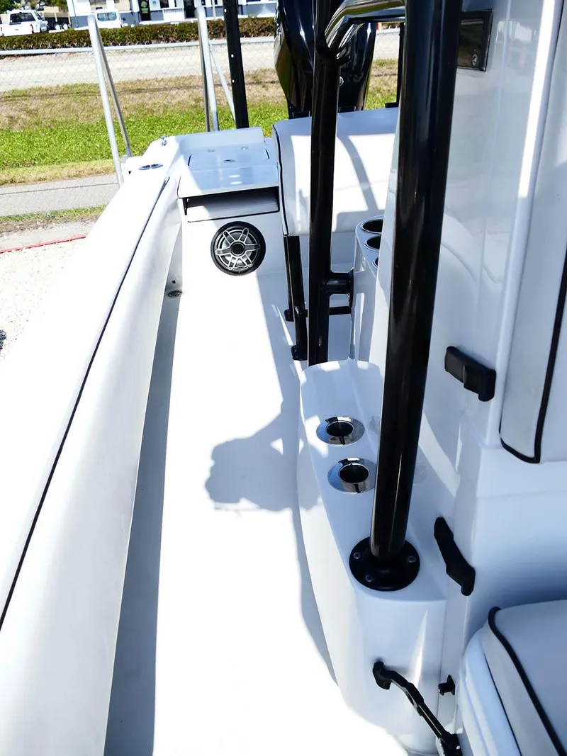 Slide: The Image of 2022 Contender 25 Bay boat interior with rod holders and seating. - 34