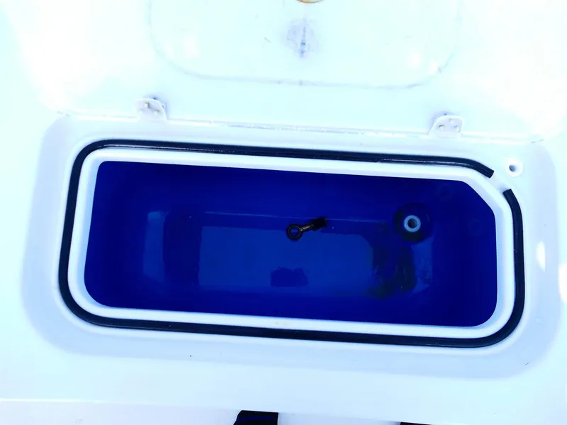 Slide: The Image of 2022 Contender 25 Bay livewell with open lid, showcasing interior design. - 38