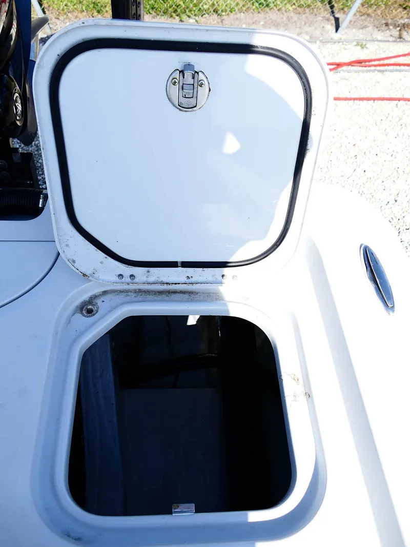 Slide: The Image of Open storage compartment on a 2022 Contender 25 Bay boat. - 39