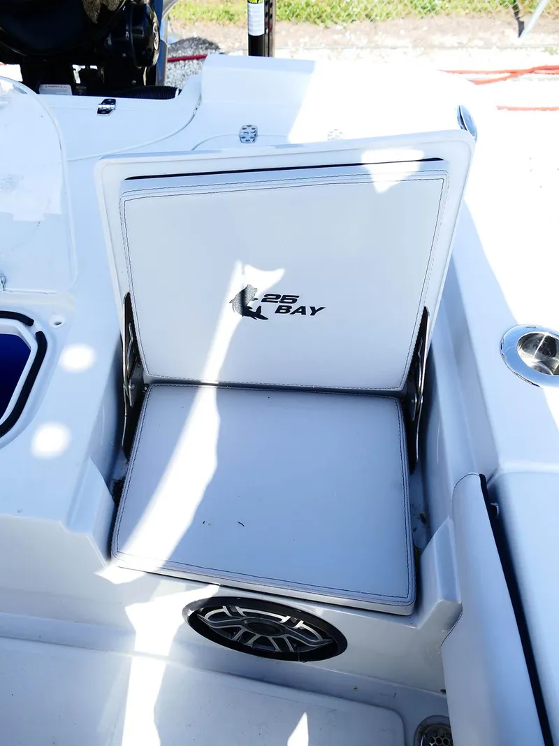 Slide: The Image of 2022 Contender 25 Bay boat seat with storage compartment and speaker. - 46