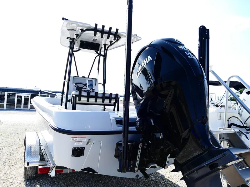 Slide: The Image of 2022 Contender 25 Bay boat with Yamaha outboard motor, rear view. - 7