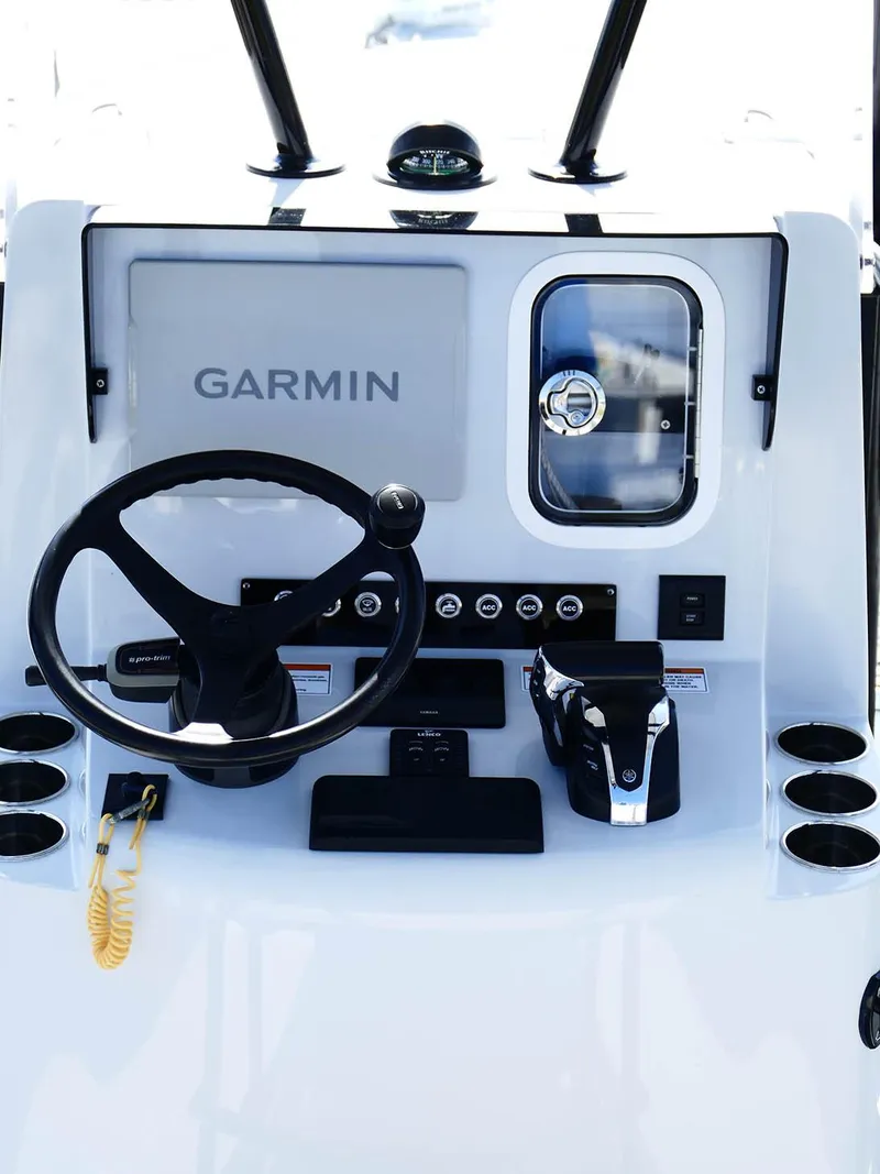 Slide: The Image of 2022 Contender 25 Bay boat console with Garmin navigation and steering wheel. - 8