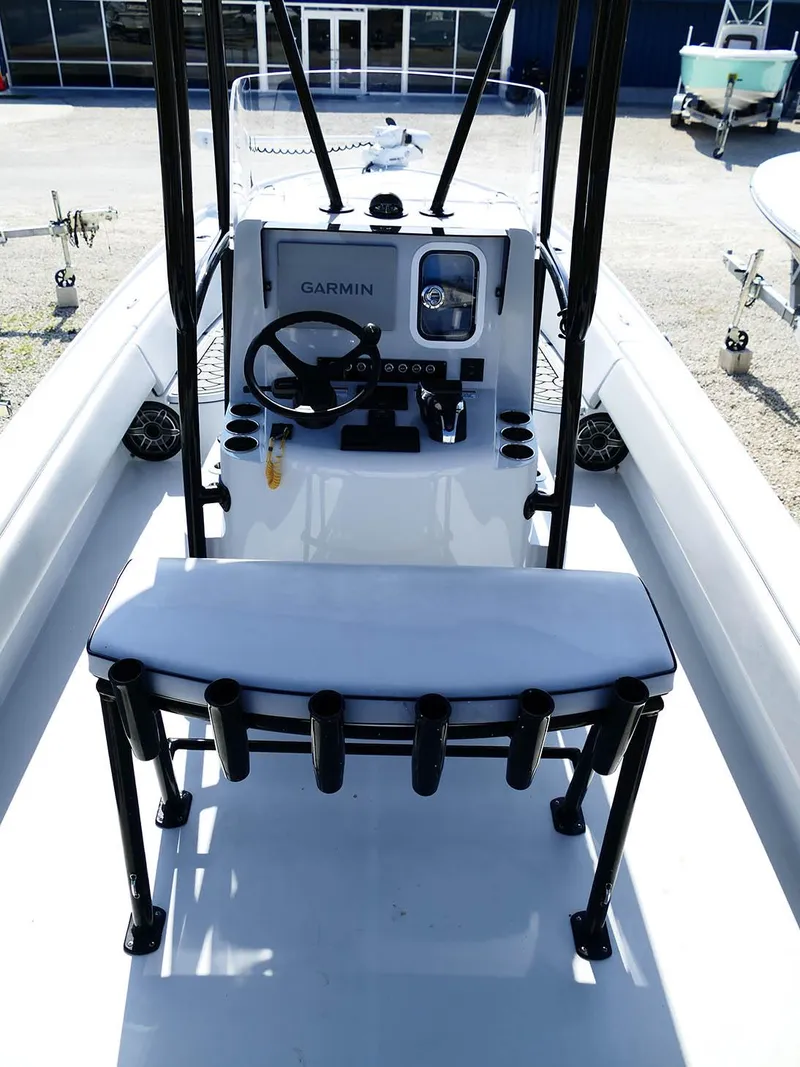 Slide: The Image of 2022 Contender 25 Bay boat interior with Garmin navigation system and rod holders. - 9