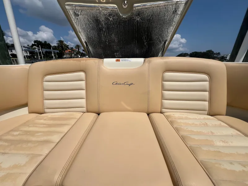 Slide: The Image of 2013 Chris-Craft Launch 22 boat interior with beige leather seating. - 16