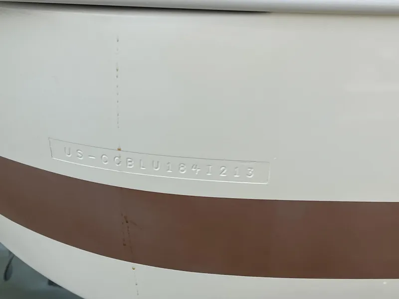 Slide: The Image of 2013 Chris-Craft Launch 22 boat hull with visible identification number. - 18