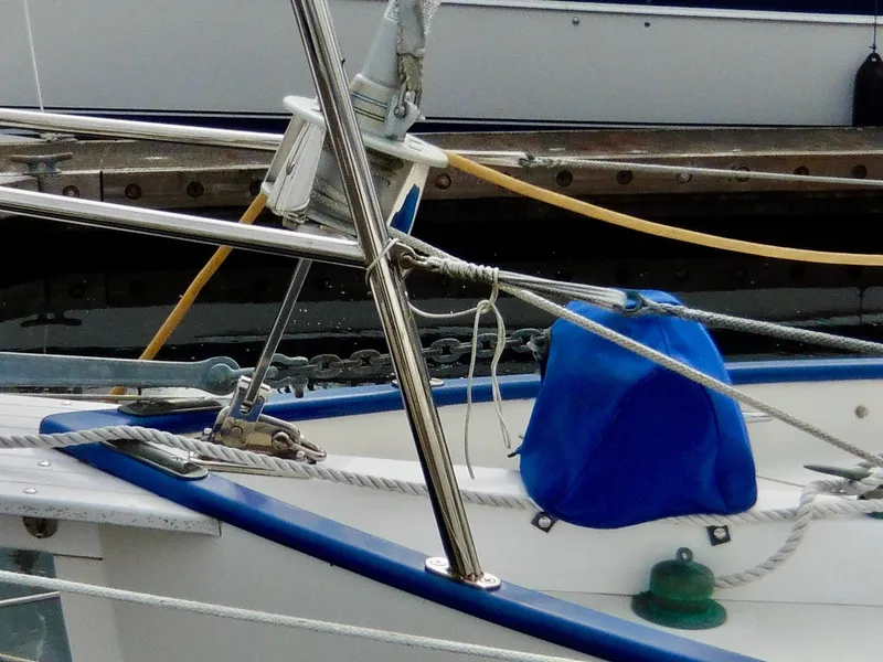 Slide: The Image of Cape George Cutter 2011 sailboat deck with ropes and blue cover. - 14