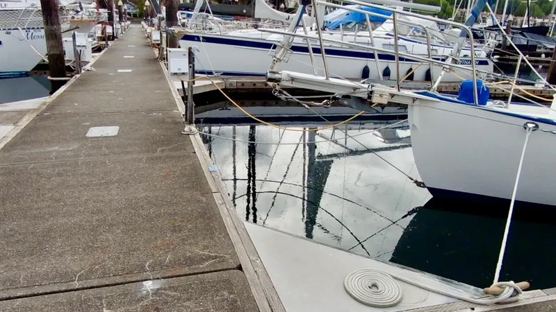 Slide: The Image of Docked 2011 Cape George Cutter sailboat with reflections on calm water. - 16