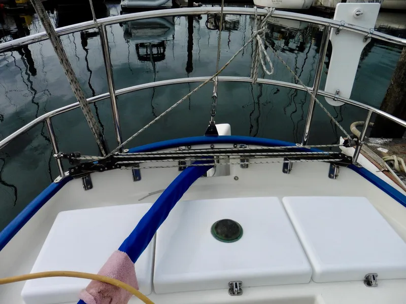 Slide: The Image of Cape George Cutter 2011 sailboat deck with railing and mooring lines. - 21