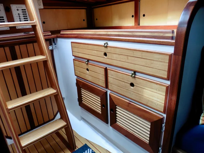 Slide: The Image of Interior of 2011 Cape George Cutter with wooden cabinetry and ladder. - 31