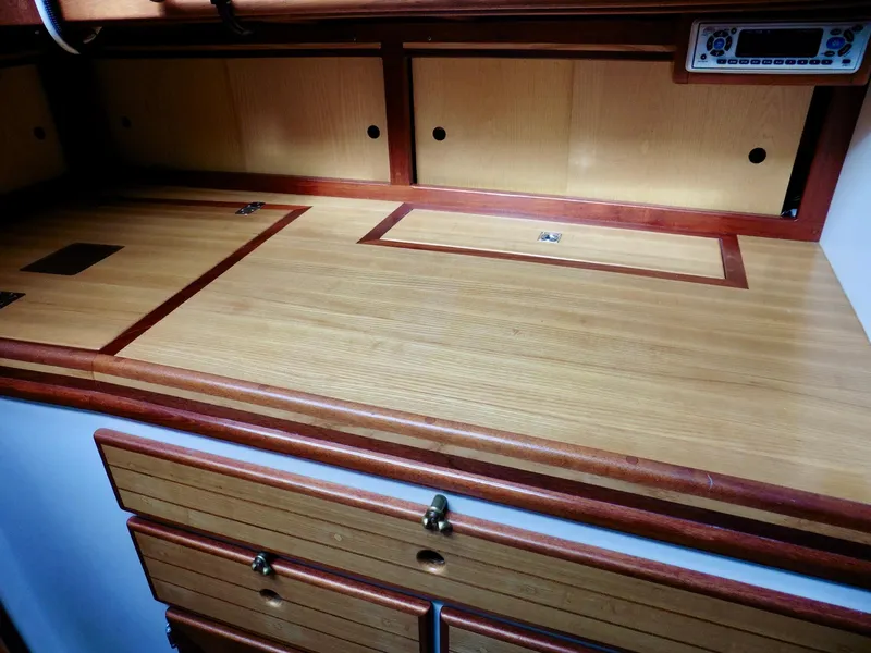 Slide: The Image of Wooden interior of 2011 Cape George Cutter, featuring storage compartments and drawers. - 32