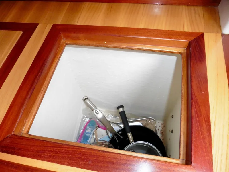 Slide: The Image of Storage compartment on 2011 Cape George Cutter with kitchen utensils inside. - 33