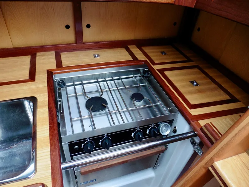 Slide: The Image of 2011 Cape George Cutter kitchen with stove and wooden cabinetry. - 35