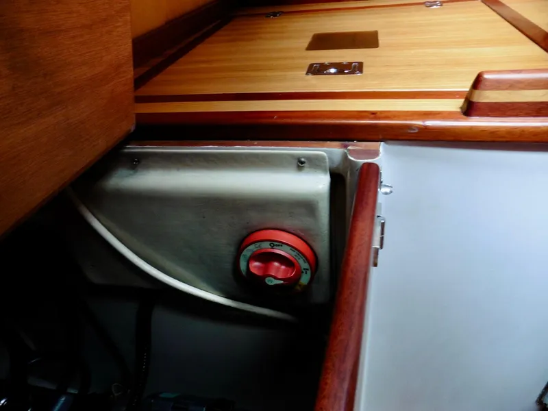 Slide: The Image of Interior view of a 2011 Cape George Cutter sailboat, featuring a control panel. - 37