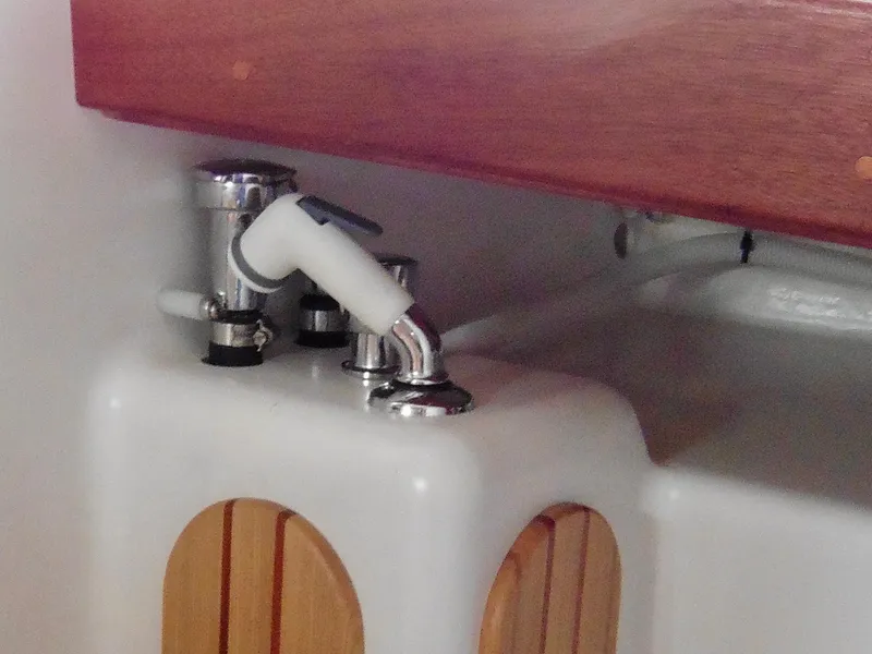 Slide: The Image of Cape George Cutter 2011 interior sink with faucet and wooden accents. - 41