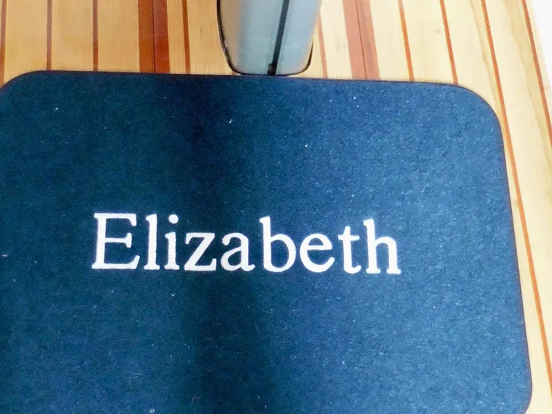 Slide: The Image of "Elizabeth" mat on Cape George Cutter 2011 wooden deck. - 44