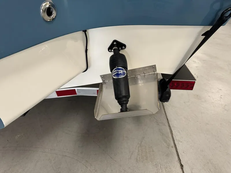 Slide: The Image of 2025 Pathfinder 2300 HPS boat detail showing trim tab and hydraulic system. - 8