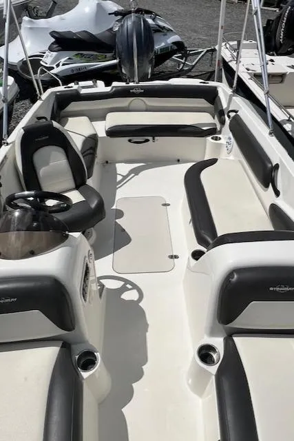 Slide: The Image of 2019 Stingray 182 SC boat interior with seating and steering wheel. - 5