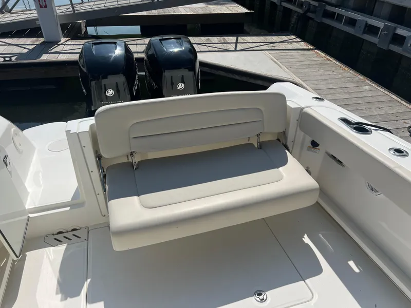 Slide: The Image of 2016 Boston Whaler 270 Vantage boat with dual engines and foldable seating. - 11