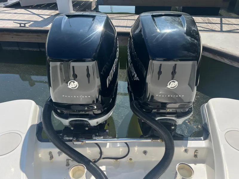 Slide: The Image of Twin Mercury outboard engines on a 2016 Boston Whaler 270 Vantage boat. - 12