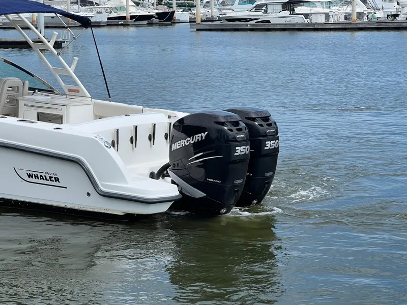 Slide: The Image of 2016 Boston Whaler 270 Vantage with twin Mercury 350 engines in marina. - 3