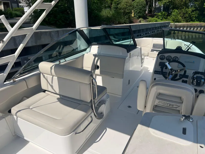 Slide: The Image of 2016 Boston Whaler 270 Vantage boat interior with seating and control panel. - 4