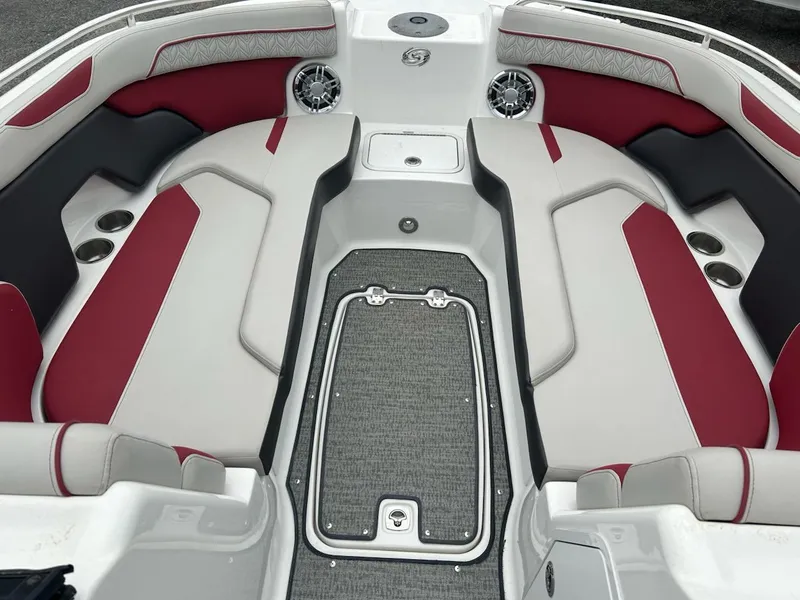 Slide: The Image of 2021 Hurricane SunDeck 2400 OB boat interior with red and gray seating. - 5