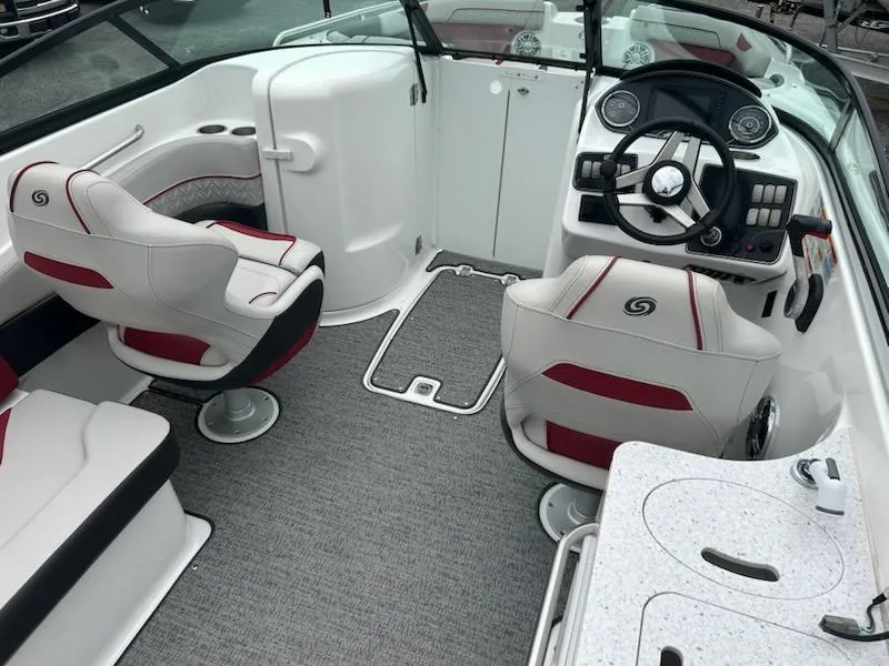 Slide: The Image of 2021 Hurricane SunDeck 2400 OB boat interior with modern seating and steering console. - 6