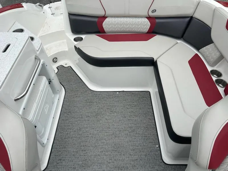 Slide: The Image of 2021 Hurricane SunDeck 2400 OB boat interior with red and black seating. - 9