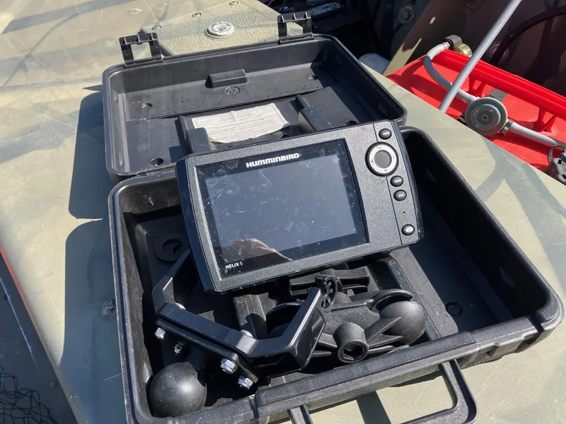 Slide: The Image of Humminbird Helix fish finder in open case on Tracker GRIZZLY 1648 AWL boat. - 7