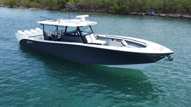 Slide: The Image of 2023 Yellowfin 42 boat on calm water, featuring sleek design and modern amenities. - 17