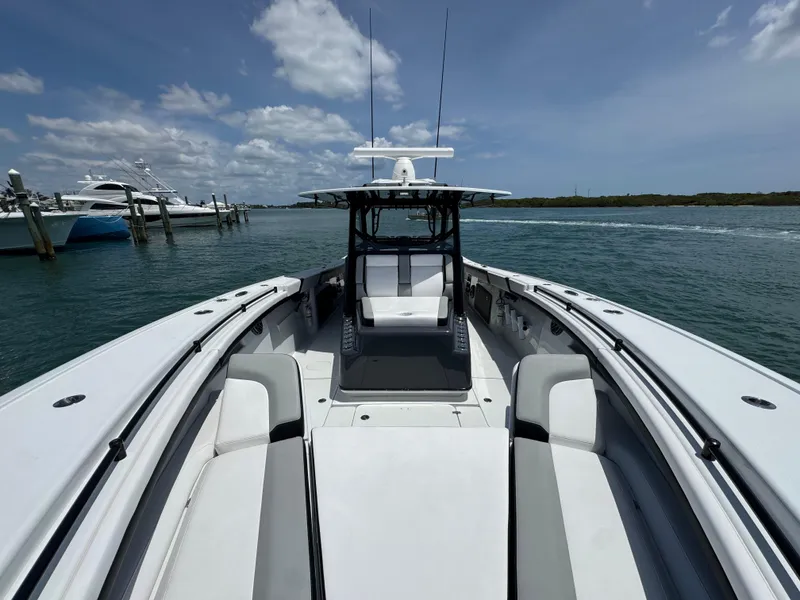 Slide: The Image of 2023 Yellowfin 42 boat on water, clear sky, luxury seating, and sleek design. - 29