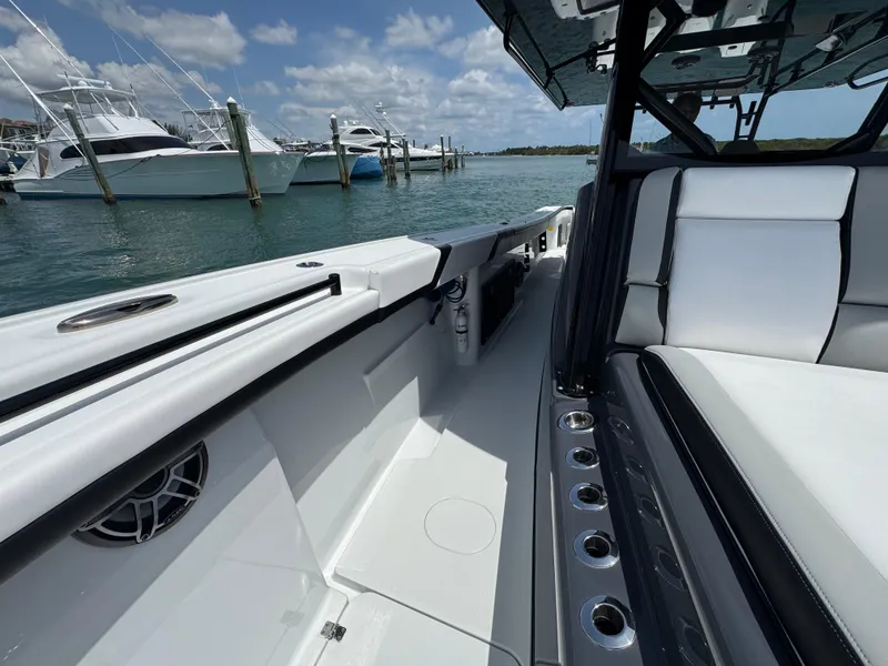Slide: The Image of 2023 Yellowfin 42 boat interior with sleek seating and ocean view. - 31