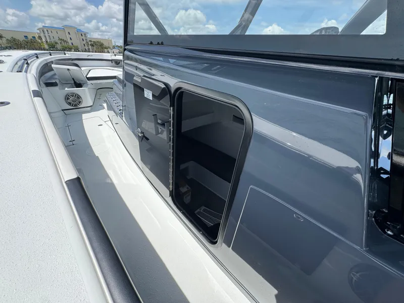 Slide: The Image of 2023 Yellowfin 42 boat with open storage compartment, sleek design, and spacious deck. - 32