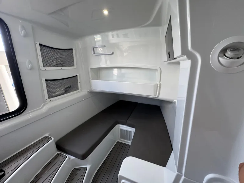 Slide: The Image of 2023 Yellowfin 42 interior cabin with seating and storage compartments. - 37