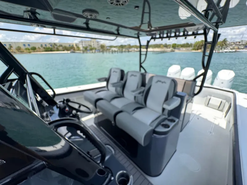 Slide: The Image of 2023 Yellowfin 42 boat interior with luxurious seating and scenic water view. - 39