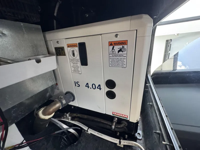 Slide: The Image of Engine compartment of a 2023 Yellowfin 42 boat, featuring a Yanmar IS 4.04 engine. - 43