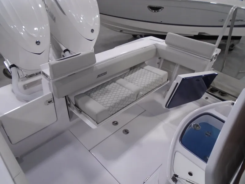 Slide: The Image of 2026 Jupiter 30 boat interior with foldable seating and dual outboard motors. - 17