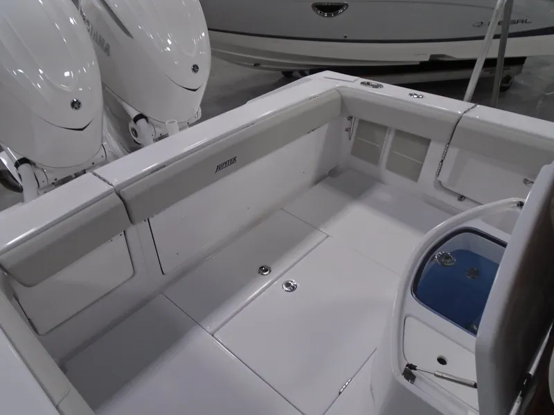 Slide: The Image of 2026 Jupiter 30 boat interior with dual engines and seating area. - 18