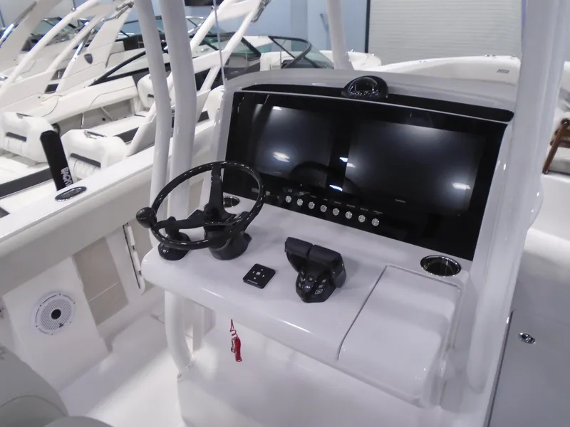 Slide: The Image of 2026 Jupiter 30 boat dashboard with steering wheel and modern controls. - 24