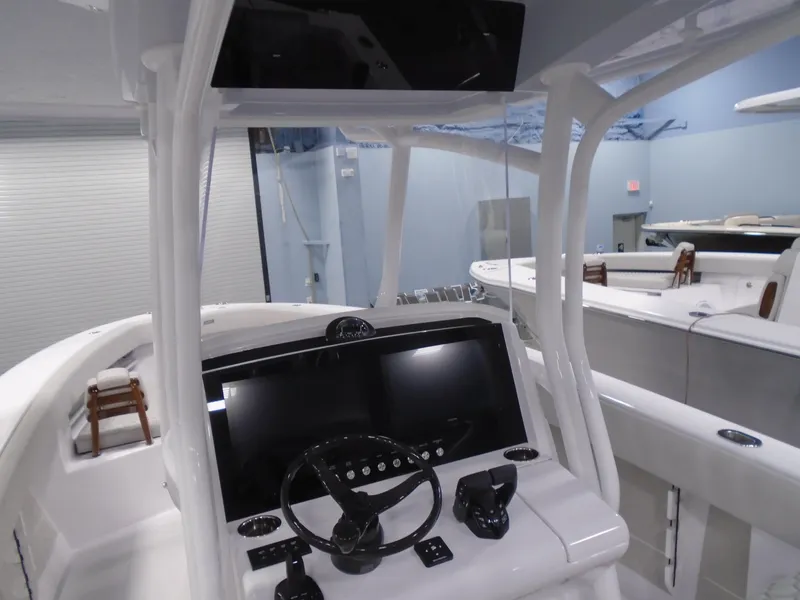 Slide: The Image of 2026 Jupiter 30 boat cockpit with modern steering and controls. - 25