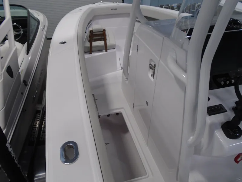 Slide: The Image of 2026 Jupiter 30 boat interior with sleek white design and modern controls. - 28