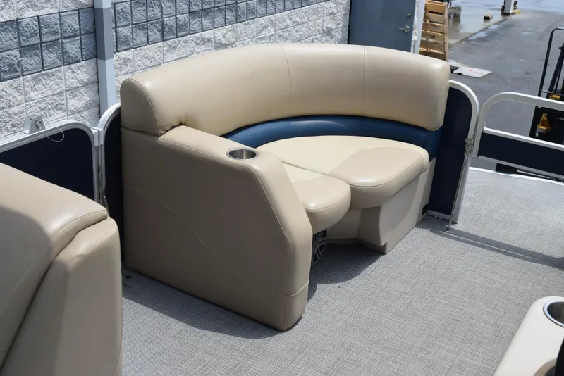Slide: The Image of 2017 Manitou Aurora LE 21 RF SHP pontoon boat seating area with beige upholstery. - 11