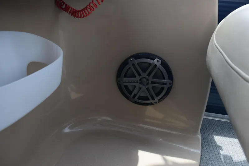 Slide: The Image of 2017 Manitou Aurora LE 21 RF SHP boat interior with speaker detail. - 15