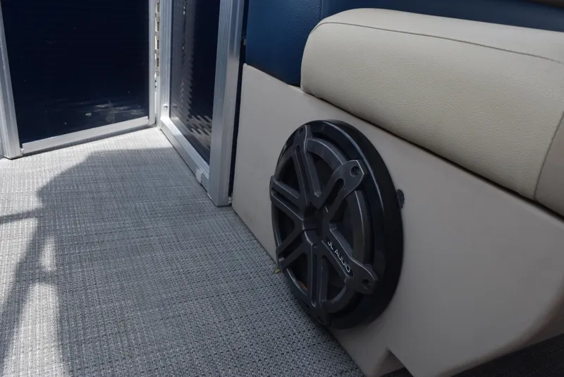 Slide: The Image of 2017 Manitou Aurora LE 21 RF SHP boat interior with speaker and seating detail. - 16