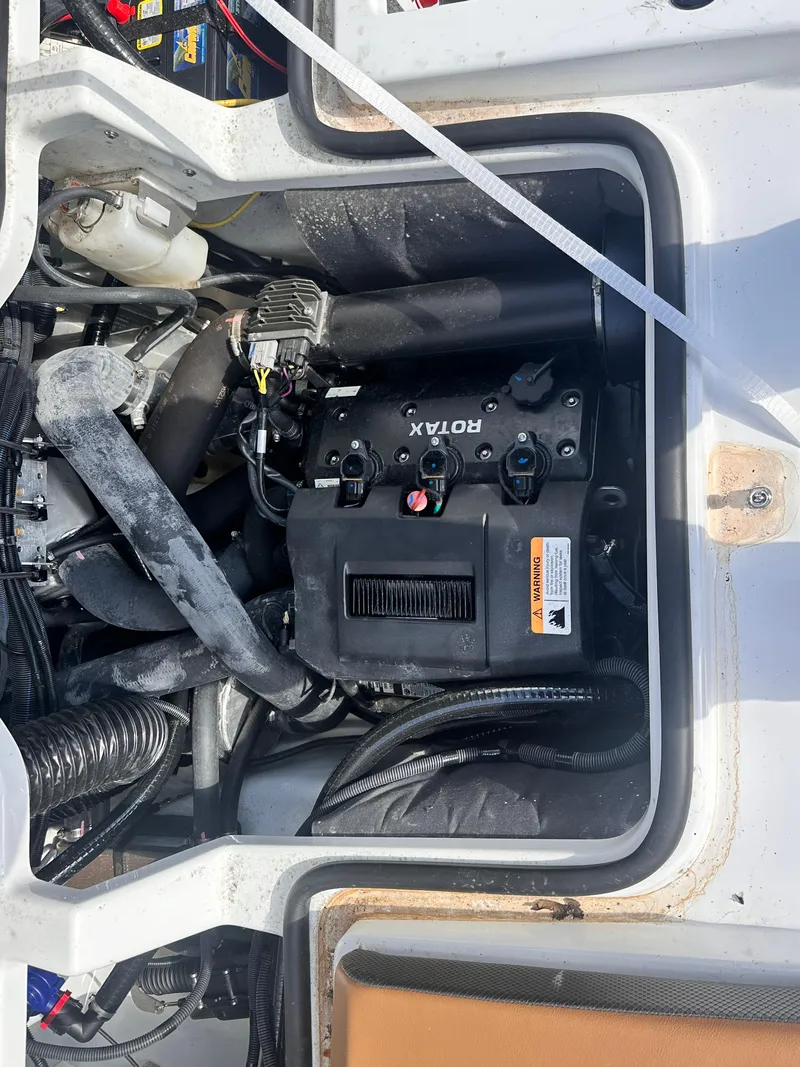 Slide: The Image of Engine compartment of a 2021 Scarab 195 Jet Boat featuring a Rotax engine. - 5