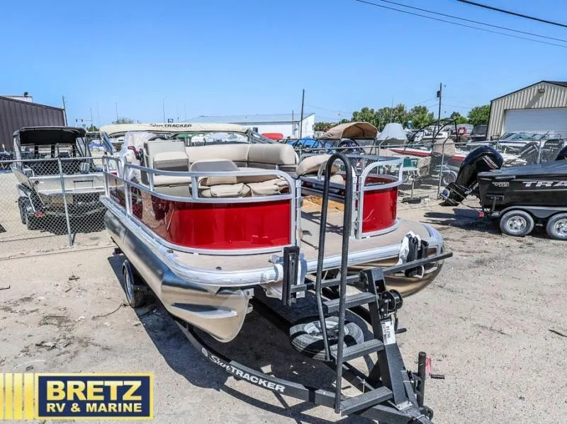 Slide: The Image of 2025 BASS BUGGY 16 XL Select pontoon boat on trailer at Bretz RV & Marine. - 1