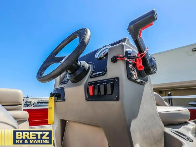 Slide: The Image of 2025 BASS BUGGY 16 XL Select boat console with steering wheel and controls. - 8