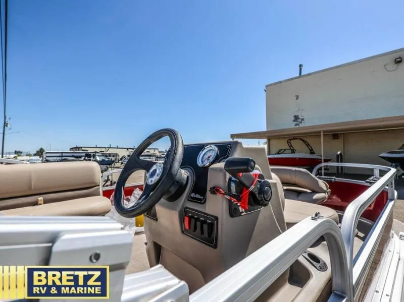 Slide: The Image of 2025 BASS BUGGY 16 XL Select boat interior with steering wheel and seating, at Bretz RV & Marine. - 9