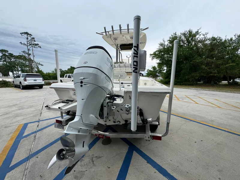 Slide: The Image of 2024 Bulls Bay 2400 boat with outboard motor in parking lot. - 14